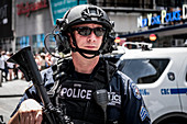 New York, United States of America - July 8, 2017. A police officer from the NYPD Counterterrorism Bureau also known as CT at the Time Square. The CT is the city's primary local resource to guard against the threat of international and domestic terrorism in New York City.