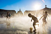 France, Gironde, Bordeaux, area listed as World Heritage by UNESCO, Saint-Pierre district, Place de la Bourse, the reflecting pool from 2006 and directed by Jean-Max Llorca fontainier