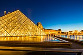 France, Paris, area listed as World Heritage by UNESCO, the Louvre Pyramid by the architect IM Pei and facade of the Cour Napoleon