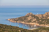 France, Corse du Sud, the natural site of Roccapina, boats at anchor in front of the beach of Roccapina