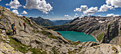 Hikers above Lake Cavagn ??, Trekking del Laghetti Alpini, Ticino, Switzerland