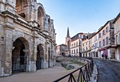 France, Bouches du Rhone, Arles, the Arenas, Roman Amphitheatre of 80-90 AD, listed as World Heritage by UNESCO, Saint Charles church in the background