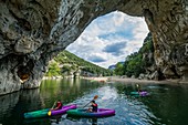 France, Ardeche, Vallon Pont d'Arc, kayak in the river Ardeche Gorges, giant stone arch