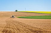 Tractor on arable field, Niefern, Grand Est, Alsace, France