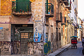 Colorful Cuban alley with old colonial house facades, Old Havana, Cuba
