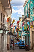 Colorful Cuban alley with colonial house facades, Old Havana, Cuba