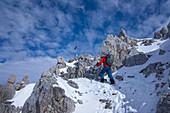 Man mountaineering at Ellmauer Tor in the Wilder Kaiser Mountains
