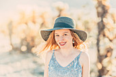 Woman with sun hat in Cholla Cactus Garden, Joshua Tree National Park, California, USA, North America
