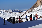 Ski under the Langkofel over Campitello, skier, ski slope, rocks, Dolomites, Trentino in winter, Italy