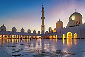 Abu Dhabi. United Arab Emirates. Sheikh Zayed Grand Mosque at dusk.. January 2020