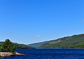 View over a large lake with hills, near Bredvad, Dalarna province, Sweden