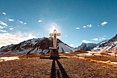 View of cross with mountains