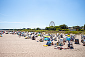 Beach panorama Kaiserbad Ahlbeck with holidaymakers beach chairs and ferris wheel, Usedom, Mecklenburg-Western Pomerania, Germany
