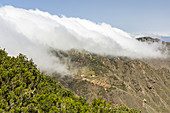 Clouds move over the mountain range in the Anaga Mountains, Tenerife, Spain