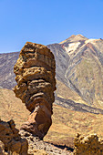 &quot;Roques de Garcia&quot; rock formations at the large crater in El Teide National Park with a view of volcanic peaks, Tenerife, Spain
