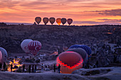 Hot air balloons waiting for fly at dusk. Goreme, Cappadocia, Kaisery district, Anatolia, Turkey.  