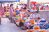 Uzbekistan peoples at Gran Bazar bread market in Sammarcanda. Samarkand, Uzbekistan, Central Asia.