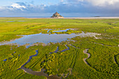 Aerial view of Le Mont Saint Michel at dawn. Normandy, Manche, Avranches, Pontorson, France, Western Europe.