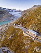 Aerial view of the Rhone glacier, the Belvedere Hotel and the Furka Pass road, famous for a scene of the James Bond film Goldfinger, a high mountain pass in the Swiss Alps connecting Gletsch, Valais with Realp, Uri. Obergoms, Canton of Valais, Swiss Alps, Switzerland.