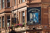 United Kingdom, London, Mayfair, North Audley Street near Oxford Street, the Marlborough Head pub, orange brick facade, portrait
