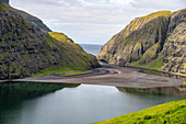 Lagoon with red algae at low tide in one of the most beautiful places in the world, Saksun, Streymoy Island in the Faroe Islands.