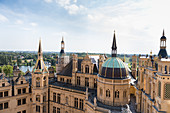 On the roofs of the Schwerin Castle surrounded by towers, domes, chimneys, Mecklenburg-Western Pomerania, Germany