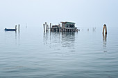 View of the fishing huts on stilts of the fishermen of Pellestrina in the Venetian lagoon, Pellestrina, Veneto, Italy, Europe