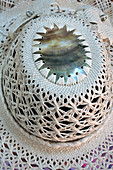 Cook Islander woman woven Rito Hat close up detail. Rito hats are worn by women to church. They are made from the uncurled immature fibre of the coconut palm and are of very high quality.