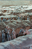 Overview of the Terracotta Army in the Terracotta Warriors and Horses Museum, which is displaying the collection of terracotta sculptures depicting the armies of Qin Shi Huang (259 BC - 210 BC), the first Emperor of China, in Xian, China.