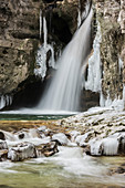 Waterfall of La Tine de Conflens under ice. Switzerland