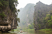 Ngo Dong River, Tam Coc near Ninh Binh, near Hanoi, Vietnam, Woman rowing