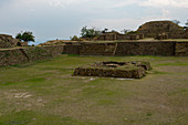 The three meter-deep Sunken Patio, or Patio Hundido, with an large altar in its center on the North Platform of Monte Alban (UNESCO World Heritage Site), which is a large pre-Columbian archaeological site in the Valley of Oaxaca region, Oaxaca, Mexico.