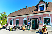 Bicycles with luggage and dog trailers in front of the Gasthaus Jägerwirt, Au an der Donau, Austria