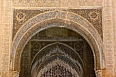 Moorish ornate arches in the interior of the Alhambra, Granada, Andalusia, Spain