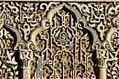 Ancient, Moorish ornamentation on the inner wall of the Alhambra, Granada, Andalusia, Spain