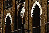 Sunlight reflects off window arches, Seville, Andalusia, Spain