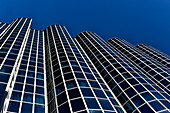 Futuristic office building with glazed facade against a deep blue sky, Zagreb, Croatia