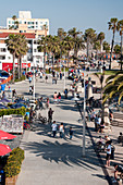 Santa Monica ocean front walk with people strolling along, Los Angeles, California, USA