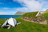 Old house and boat at Sudureiri beach. Westfjords. Iceland