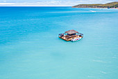 Couple on paddleboard close to the floating Ocean Bar, Caribbean, Antilles, Central America