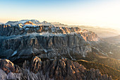 Aerial view of Sella Group at sunset in autumn, Val Gardena, Val di Fassa, Dolomites, South Tyrol, Italy