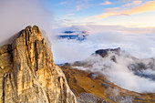 Autumn mist at sunset over Lastoi De Formin and Mondeval, aerial view, Giau Pass, Dolomites, Belluno province, Veneto, Italy