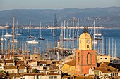 France, Var, Saint-Tropez, parochial church Notre-Dame of the Assumption and the traditional yachts on the occasion of the " Voiles de Saint-Tropez"