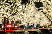 France, Paris, Taxi line Avenue Montaigne and Christmas lights