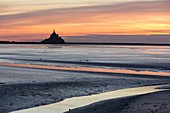 France, Manche, Mont Saint Michel bay listed as World Heritage by UNESCO, sunset over Mont Saint Michel