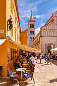 View of busy restaurant and Cathedral of St. Anastasia, Zadar, Zadar county, Dalmatia region, Croatia, Europe