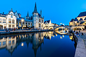 Graslei Quay in the historic city center of Ghent, mirrored in the River Lys during blue hour, Ghent, Belgium, Europe