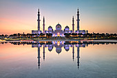 Abu Dhabi's magnificent Grand Mosque viewed in a reflecting pool, Abu Dhabi, United Arab Emirates, Middle East