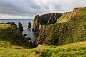 Westerwick, dramatic coastal views, red granite sea cliffs and stacks, West Mainland, Shetland Isles, Scotland, United Kingdom, Europe