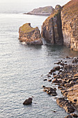 The rocky coast at Cap Frehel at sunset. Brittany, France.